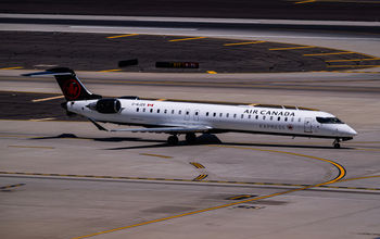 Air Canada Jazz Bombardier CRJ900 C-GJZS landing on runway 26 at Phoenix Sky Harbor Intl. Airport.