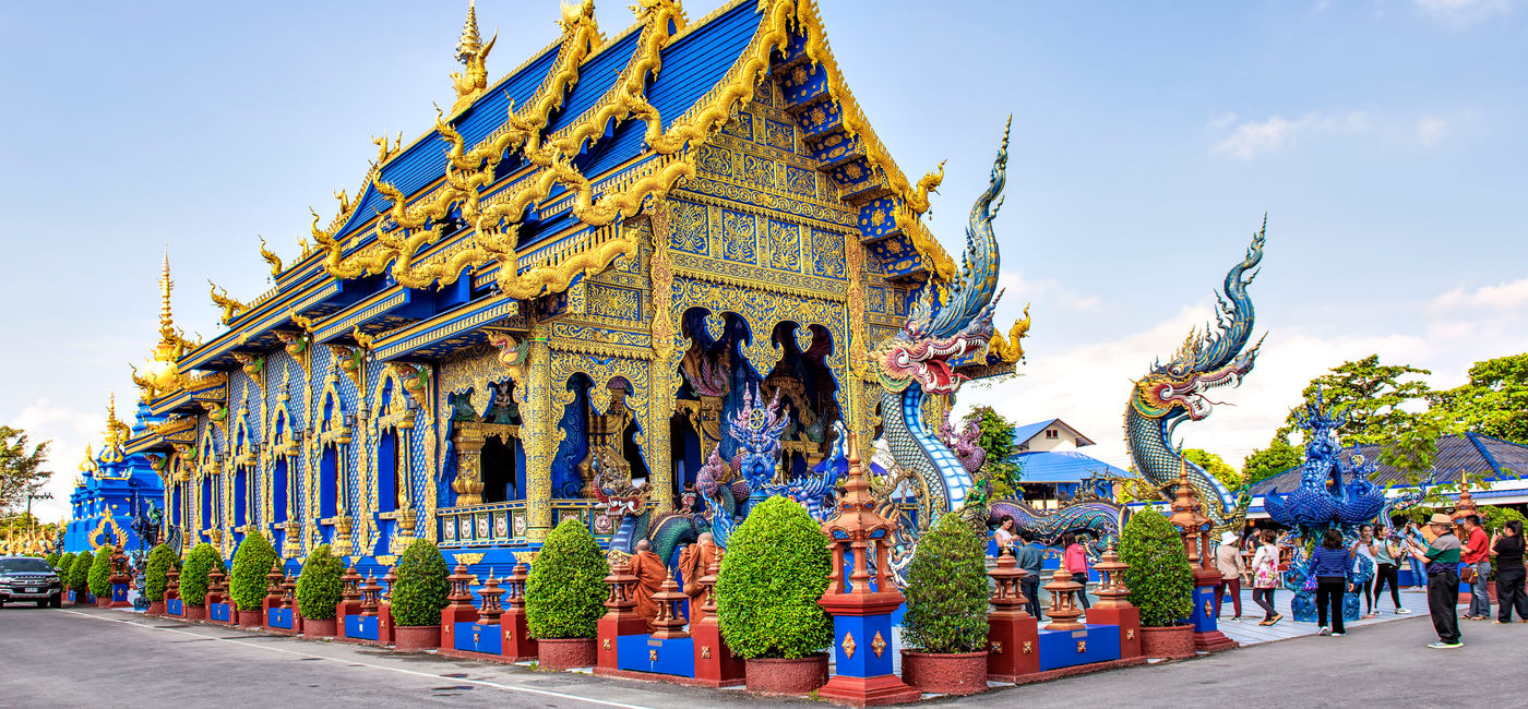 Image: Main Blue Chapel of Wat Rong Suea Ten Temple, Chiangrai, Thailand. (Photo Credit: iamdoctoregg / Adobe Stock)