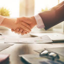 Business handshake in an office