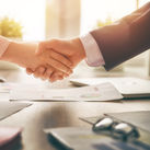Business handshake in an office