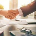 Business handshake in an office