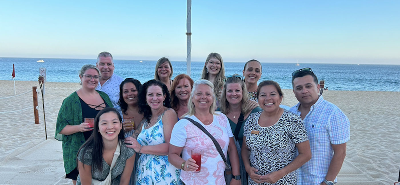 Image: Travel agent FAM group on the beach at Sandos Finisterra Los Cabos. (Photo Credit: Marsha Mowers)