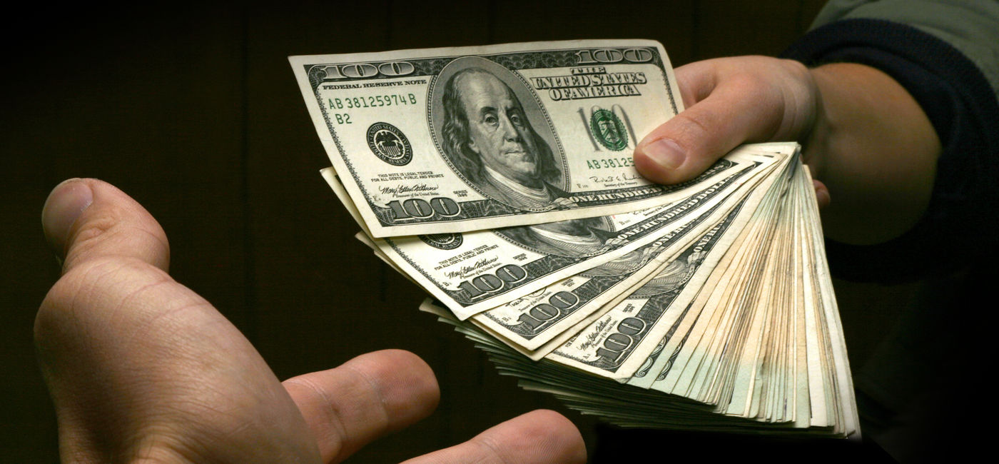 Image: Getting some extra cash. (Photo Credit: Adobe Stock/JKeen)