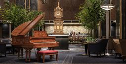 Hilton will reopen the Waldorf Astoria New York—home to the iconic lobby clock and Peacock Alley Bar—this spring.