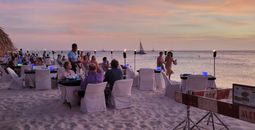 Diners on Aruba's Eagle Beach