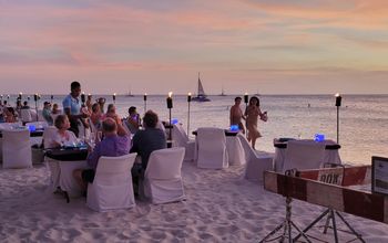 Diners on Aruba's Eagle Beach