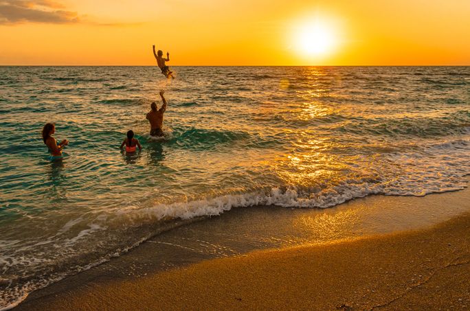 A family playing in the ocean A family playing in the ocean