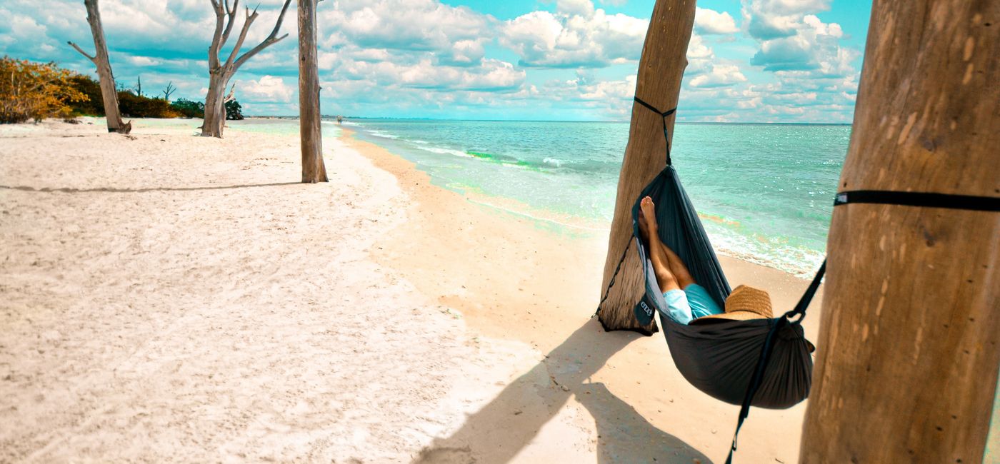 Image: Relaxing in a hammock. (photo via The Beaches of Fort Myers & Sanibel) (Lee VCB)
