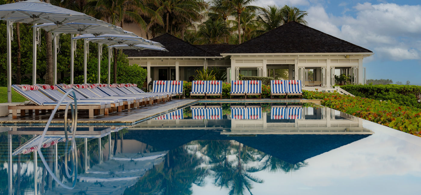 Image: The Ocean Pool's loungers, towels and umbrellas have been restyled by Jacquemus. (Photo Credit: Four Seasons)
