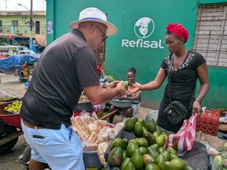 Carlos Batista shops for avocados at the Higüey market.