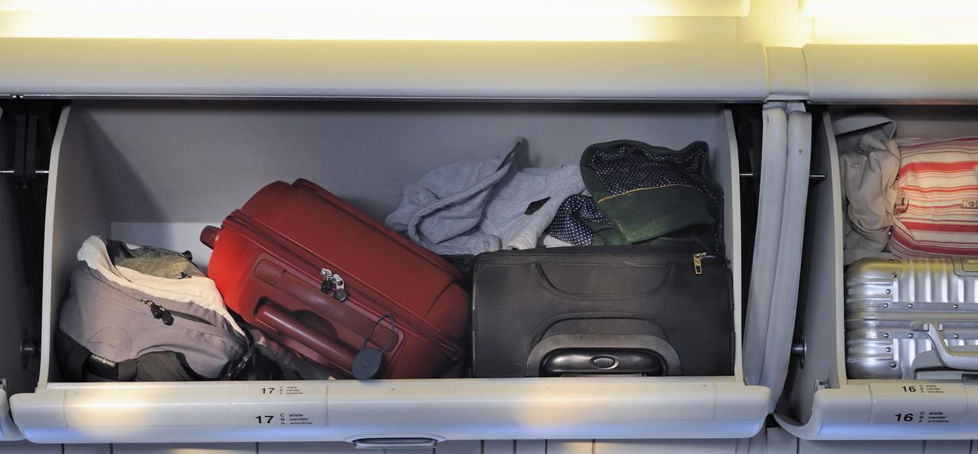 Image: PHOTO: Carry-on luggage in the overhead bin. (photo via vanbeets/iStock/Getty Images Plus)