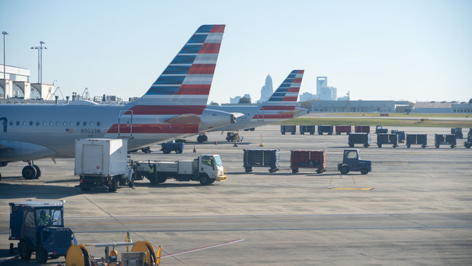 American Airlines airplane at the gate of the Charlotte Douglas International Airport. American Airlines airplane at the gate of the Charlotte Douglas International Airport.
