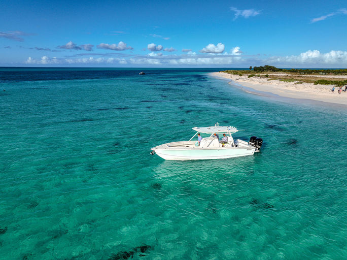 A boat anchored off of Pine Cay, Turks and Caicos A boat anchored off of Pine Cay, Turks and Caicos