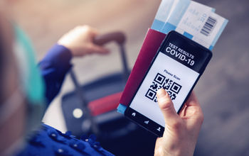 Mobile app displaying QR code linked to traveler's COVID-19 test results.