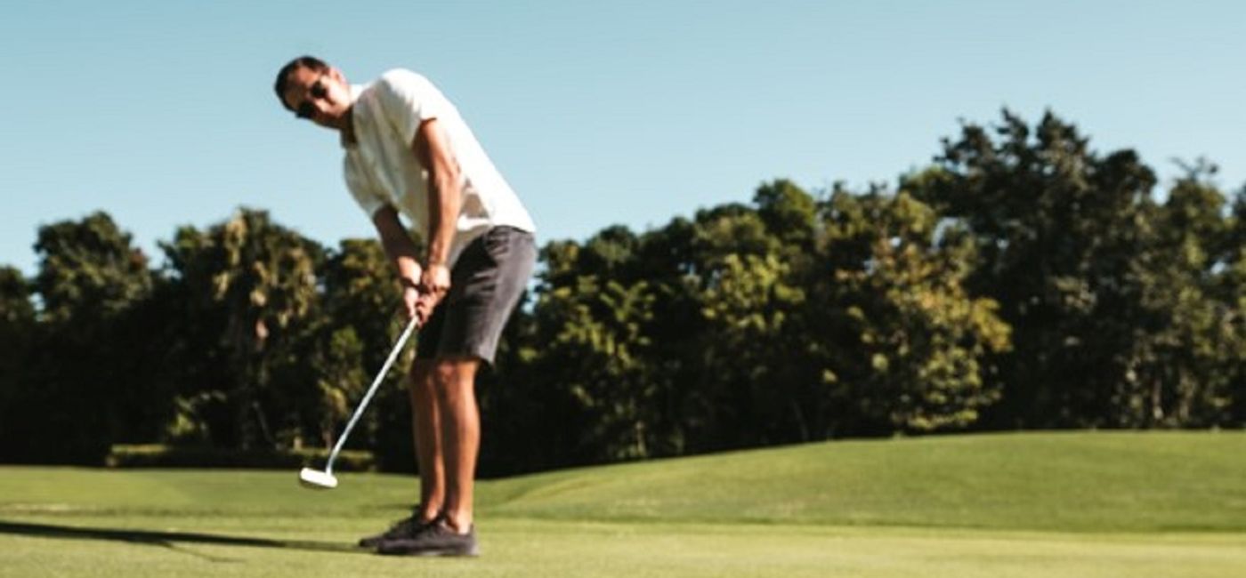 Image: Man golfing at a Hard Rock golf club. (photo courtesy of AIC Hotel Group)