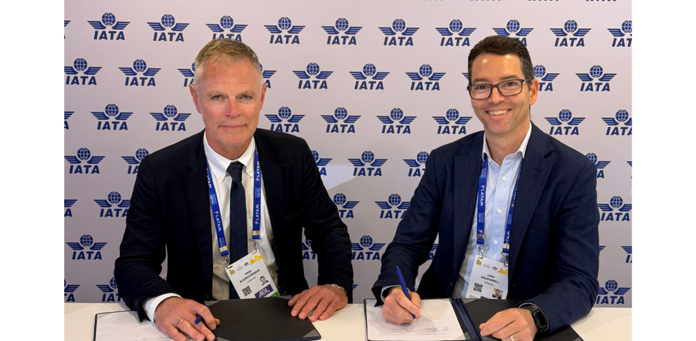 John Weatherill, WestJet Executive Vice-President and Chief Commercial Officer and Helgi Már Björgvinsson, Icelandair Head of Airline Partnerships & International Relations sign reciprocal codeshare agreement at the 2026 IATA AGM.