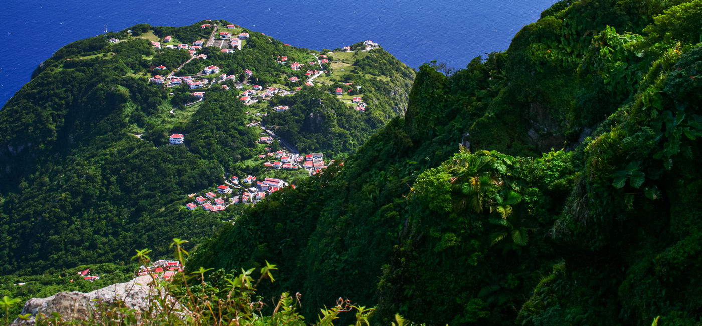 Image: Aerial view from Mount Scenery on Saba. (Photo Credit: Adobe/Ovnigraphic)