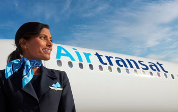 Air Transat plane with flight attendant