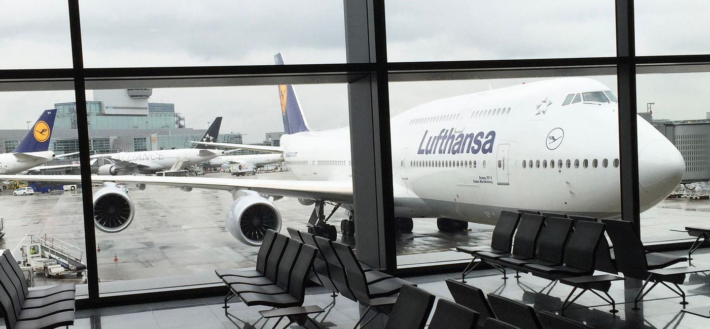 Image: A Lufthansa 747 is seen from the concourse at Frankfurt Airport in Germany. (Photo Credit: Photo by Paul J. Heney.)