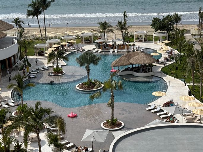 View of the pool and beach at UNICO 20°105° Hotel Riviera Nayarit