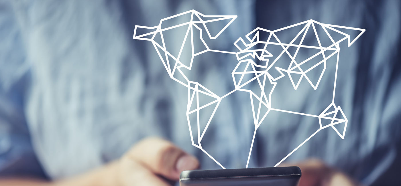 Image: Globally connected via smartphone. (Photo via iStock/Getty Images E+/Warchi)
