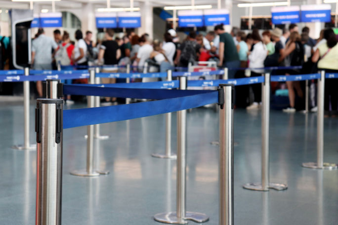 Queue for customs and immigration screening at an airport. Queue for customs and immigration screening at an airport.