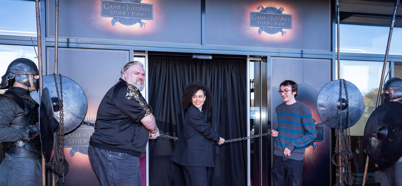 Image: Kristian Nairn (“Hodor”), Nathalie Emmanuel (“Missandei”) and Isaac Hempstead Wright (“Bran Stark”) help to ‘Break the Chains’ for the brand-new Game of Thrones Studio Tour, Banbridge, Northern Ireland. (photo courtesy of Warner Bros. Consumer Products)