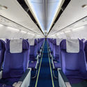 Empty passenger airplane seats in cabin.