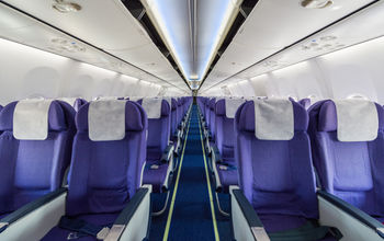 Empty passenger airplane seats in cabin.