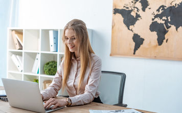 Travel advisor working from a laptop