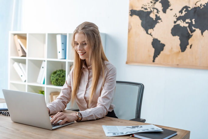 Travel advisor working from a laptop