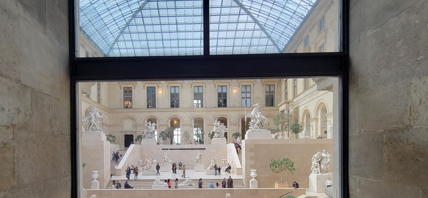 Image: The statue garden inside The Louvre Museum, Paris. (Photo Credit: Lacey Pfalz)