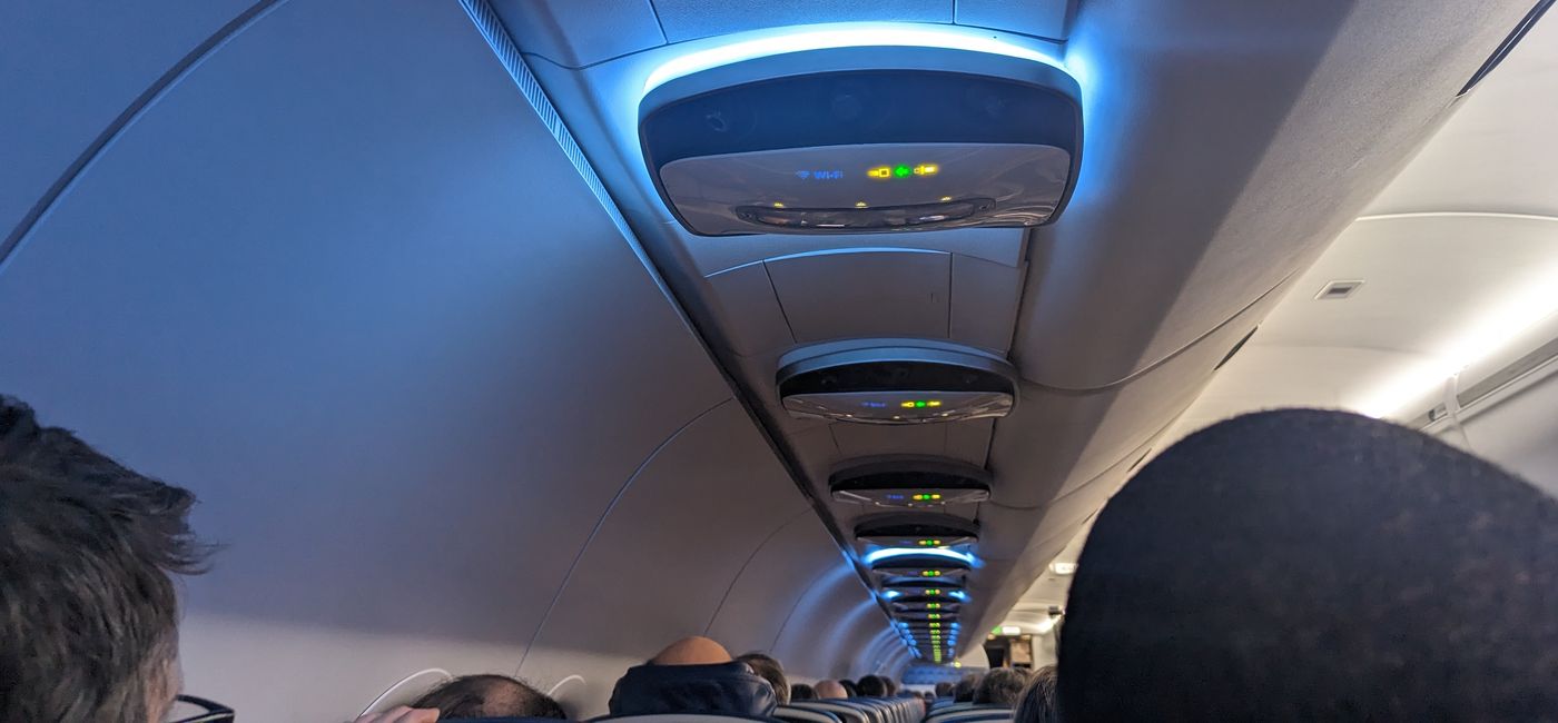 Image: Plane cabin wifi and seat belt sign (photo by Eric Bowman)