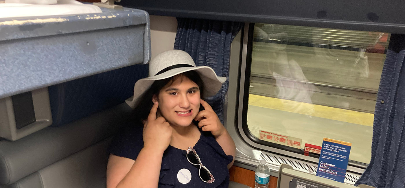 Image: Leni aboard Amtrak’s California Zephyr train. (Photo Credit: Railbookers)