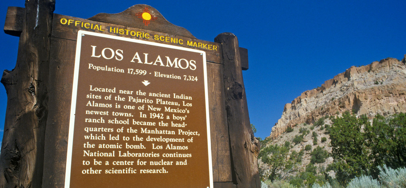 Image: Sign at the entrance to Los Alamos, New Mexico. (Photo Credit: spiritofamerica/Adobe Stock)