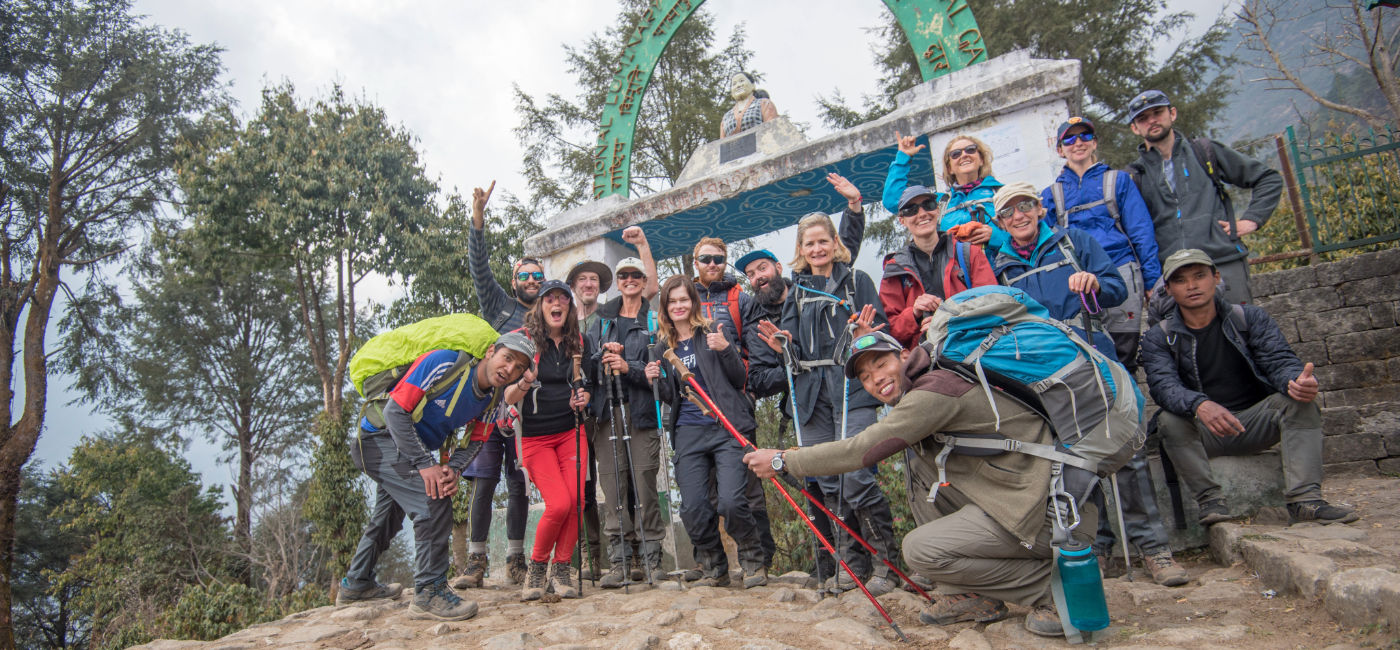 Image: Travelers and their guides pose for a photo on Day 13 of an Everest trek with Intrepid Travel. (Photo Credit: Intrepid Travel)