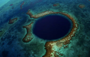 The magnificent Blue Hole is one of the natural wonders that Belize offers its visitors. (Photo via Belize Tourism Board).