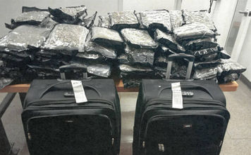 Two suitcases containing 56 kg of cannabis were seized on July 10.
