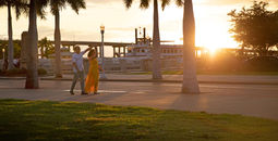 Couple enjoying a sunset in Fort Myers’ islands, beaches and neighborhoods.
