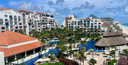 The wrap-around balcony of the Fiesta Americana Condesa Cancun Presidential Suite has a view of the entire property, including the beautiful Cancun beach.