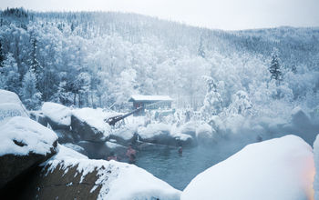 Alaska's Chena Hot Springs Resort invites guests to slip into mineral-rich waters beneath wide open skies—often with the aurora borealis dancing overhead.
