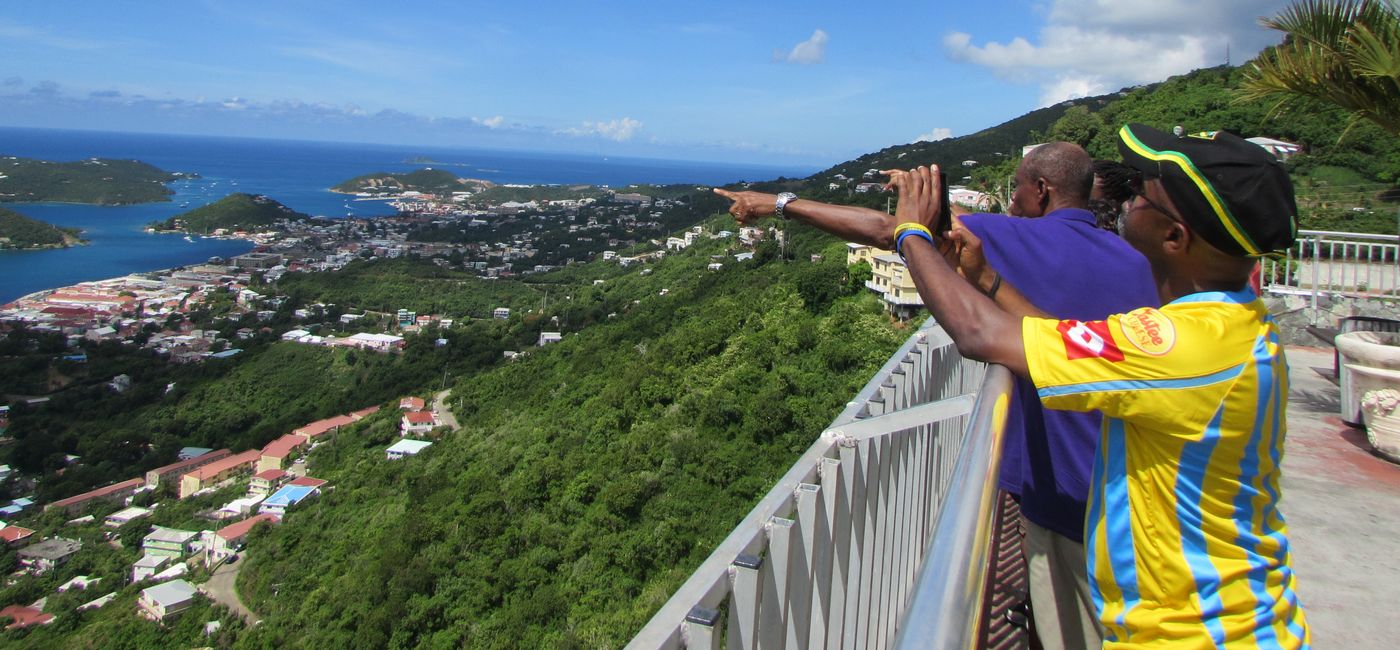 Image: Travelers looking out at Charlotte Amalie harbor in St. Thomas USVI. (photo by Brian Major)
