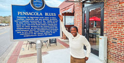 Trail marker outside of Five Sisters Blues Cafe in Pensacola, Florida
