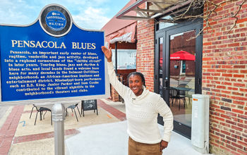 Trail marker outside of Five Sisters Blues Cafe in Pensacola, Florida