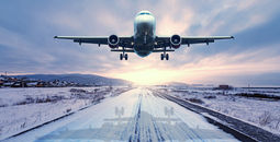 Plane takes off in the snow.