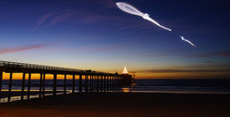 SpaceX launch vehicle Falcon 9 rockets through the atmosphere Scripps Pier in San Diego, California.
