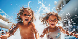 Kids playing in a cruise ship's pool area.