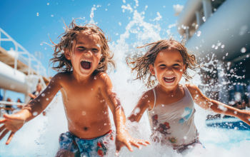 Kids playing in a cruise ship's pool area.