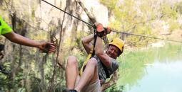 The author on a zip line at Canyons Zip Line and Adventure Park