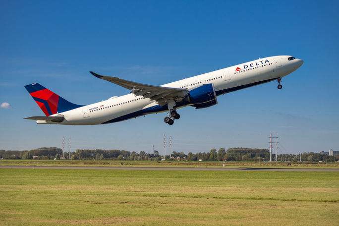 Delta Air Lines plane taking off from Amsterdam's Schiphol Airport